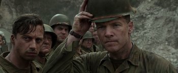 Movie still from “Hacksaw Ridge” (2016), directed by Mel Gibson – A group of men standing next to each other; Close Up shot, Low angle