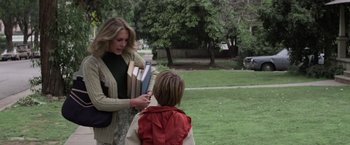 Movie still from “Halloween” (1978), directed by John Carpenter – A woman and a child in a park; Medium shot, Over the shoulder angle