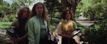 Movie still from “Halloween” (1978), directed by John Carpenter – Two women standing next to each other on a sidewalk; Medium shot, Low angle