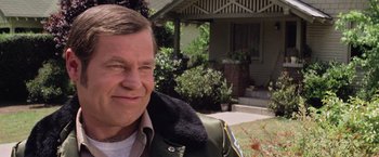 Movie still from “Halloween” (1978), directed by John Carpenter – A person wearing a jacket outside; Close Up shot, Low angle