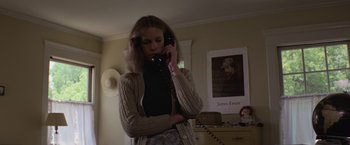 Movie still from “Halloween” (1978), directed by John Carpenter – A woman holding a cell phone to her ear; Medium shot, Low angle