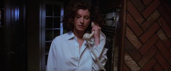 Movie still from “Halloween” (1978), directed by John Carpenter – A woman holding a phone up to her ear; Close Up shot, Low angle