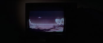 Movie still from “Halloween” (1978), directed by John Carpenter – A television screen with a picture of an alien landscape; Extreme Wide shot, High angle