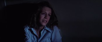 Movie still from “Halloween” (1978), directed by John Carpenter – A woman in a blue shirt is looking sad; Close Up shot, Low angle
