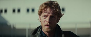 Movie still from “Halloween” (2018), directed by David Gordon Green – A person with a beard; Close Up shot, Over the shoulder angle