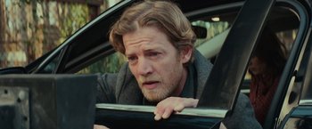 Movie still from “Halloween” (2018), directed by David Gordon Green – A person leaning on a car window; Close Up shot, Over the shoulder angle