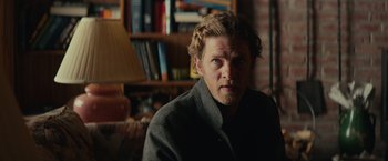 Movie still from “Halloween” (2018), directed by David Gordon Green – A person wearing a jacket; Close Up shot, Over the shoulder angle