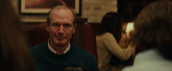 Movie still from “Halloween” (2018), directed by David Gordon Green – A person holding a glass of wine; Close Up shot, Over the shoulder angle