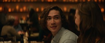 Movie still from “Halloween” (2018), directed by David Gordon Green – A person with curly brown hair; Close Up shot, Over the shoulder angle