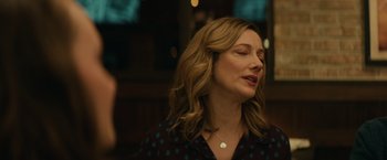 Movie still from “Halloween” (2018), directed by David Gordon Green – A person wearing a necklace; Close Up shot, Over the shoulder angle