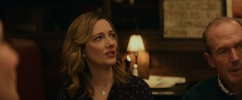 Movie still from “Halloween” (2018), directed by David Gordon Green – A person wearing a necklace; Close Up shot, Over the shoulder angle