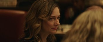 Movie still from “Halloween” (2018), directed by David Gordon Green – A person with long blonde hair; Close Up shot, Over the shoulder angle