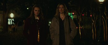 Movie still from “Halloween” (2018), directed by David Gordon Green – Two women standing next to each other on a street; Medium shot, Over the shoulder angle