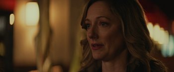 Movie still from “Halloween” (2018), directed by David Gordon Green – A woman's face in the dark; Close Up shot, Over the shoulder angle