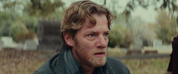 Movie still from “Halloween” (2018), directed by David Gordon Green – A person with a beard; Close Up shot, Over the shoulder angle