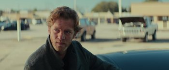 Movie still from “Halloween” (2018), directed by David Gordon Green – A person sitting in a car; Close Up shot, Over the shoulder angle