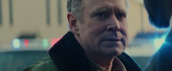 Movie still from “Halloween” (2018), directed by David Gordon Green – An older man wearing a jacket and looking to his left; Close Up shot, Over the shoulder angle