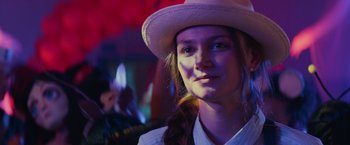 Movie still from “Halloween” (2018), directed by David Gordon Green – A woman wearing a white hat and a white jacket; Close Up shot, Over the shoulder angle