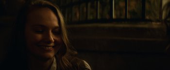 Movie still from “Halloween” (2018), directed by David Gordon Green – A person sitting in a room; Close Up shot, Over the shoulder angle