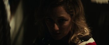 Movie still from “Halloween” (2018), directed by David Gordon Green – A person's face in the dark; Close Up shot, Low angle