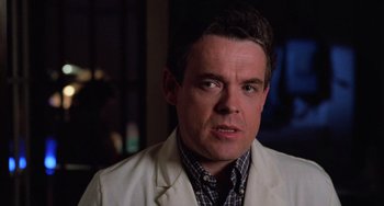 Movie still from “Halloween 4: The Return of Michael Myers” (1988), directed by Dwight H. Little – A person wearing a white jacket; Close Up shot, Over the shoulder angle