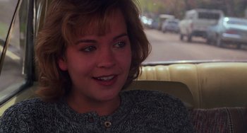 Movie still from “Halloween 4: The Return of Michael Myers” (1988), directed by Dwight H. Little – A person sitting in a car; Close Up shot, Over the shoulder angle