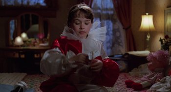 Movie still from “Halloween 4: The Return of Michael Myers” (1988), directed by Dwight H. Little – A young girl dressed as a princess playing with a toy; Medium shot, High angle