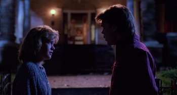 Movie still from “Halloween 4: The Return of Michael Myers” (1988), directed by Dwight H. Little – Two young men are facing each other in the dark; Medium shot, Over the shoulder angle