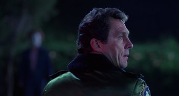 Movie still from “Halloween 4: The Return of Michael Myers” (1988), directed by Dwight H. Little – A person wearing a jacket; Close Up shot, Over the shoulder angle
