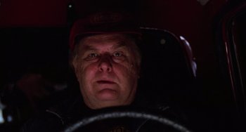 Movie still from “Halloween 4: The Return of Michael Myers” (1988), directed by Dwight H. Little – A person driving a car at night; Close Up shot, Low angle