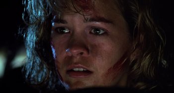 Movie still from “Halloween 5: The Revenge of Michael Myers” (1989), directed by Dominique Othenin-Girard – A person with blood all over their face; Close Up shot, Low angle