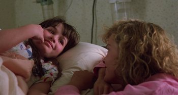 Movie still from “Halloween 5: The Revenge of Michael Myers” (1989), directed by Dominique Othenin-Girard – Two young girls laying in bed talking to each other; Close Up shot, Over the shoulder angle