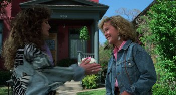 Movie still from “Halloween 5: The Revenge of Michael Myers” (1989), directed by Dominique Othenin-Girard – Two women are talking outside of a house; Medium shot, Over the shoulder angle