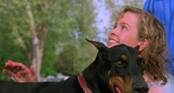 Movie still from “Halloween 5: The Revenge of Michael Myers” (1989), directed by Dominique Othenin-Girard – A person with a dog; Close Up shot, Low angle