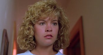 Movie still from “Halloween 5: The Revenge of Michael Myers” (1989), directed by Dominique Othenin-Girard – A person with curly blonde hair; Close Up shot, Low angle