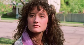 Movie still from “Halloween 5: The Revenge of Michael Myers” (1989), directed by Dominique Othenin-Girard – A person with long curly hair; Close Up shot, Low angle