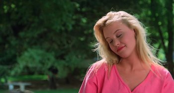Movie still from “Halloween 5: The Revenge of Michael Myers” (1989), directed by Dominique Othenin-Girard – A woman in a pink shirt is smiling; Close Up shot, Low angle