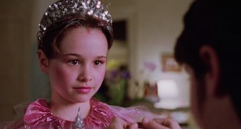 Movie still from “Halloween 5: The Revenge of Michael Myers” (1989), directed by Dominique Othenin-Girard – A young girl wearing a tiara and a pink dress; Close Up shot, Over the shoulder angle