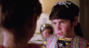Movie still from “Halloween 5: The Revenge of Michael Myers” (1989), directed by Dominique Othenin-Girard – A young boy wearing a pirate hat and a colorful shirt; Close Up shot, Over the shoulder angle