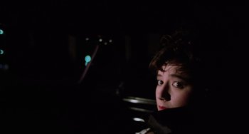 Movie still from “Halloween 5: The Revenge of Michael Myers” (1989), directed by Dominique Othenin-Girard – A young man sitting in a car at night; Close Up shot, Over the shoulder angle