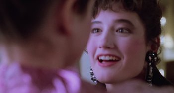 Movie still from “Halloween 5: The Revenge of Michael Myers” (1989), directed by Dominique Othenin-Girard – A woman's face with purple lighting; Close Up shot, Over the shoulder angle