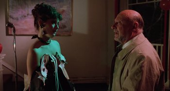 Movie still from “Halloween 5: The Revenge of Michael Myers” (1989), directed by Dominique Othenin-Girard – An older man and a younger woman in a room; Medium shot, Over the shoulder angle