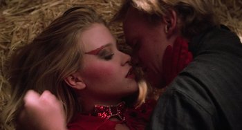 Movie still from “Halloween 5: The Revenge of Michael Myers” (1989), directed by Dominique Othenin-Girard – A man and a woman are kissing in the hay; Close Up shot, Overhead angle
