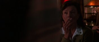 Movie still from “Halloween H20: 20 Years Later” (1998), directed by Steve Miner – A woman with her hands over her mouth; Close Up shot, Low angle