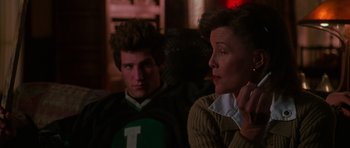 Movie still from “Halloween H20: 20 Years Later” (1998), directed by Steve Miner – A woman and a man sitting next to each other in a room; Close Up shot, Over the shoulder angle