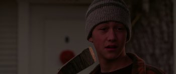 Movie still from “Halloween H20: 20 Years Later” (1998), directed by Steve Miner – A young man holding a wooden stick in his hands; Close Up shot, High angle