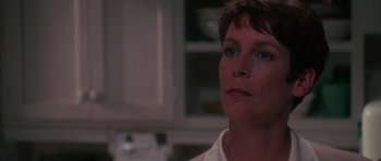 Movie still from “Halloween H20: 20 Years Later” (1998), directed by Steve Miner – A person with short brown hair; Close Up shot, Over the shoulder angle
