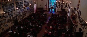 Movie still from “Halloween H20: 20 Years Later” (1998), directed by Steve Miner – A large group of people sitting in a room; Extreme Wide shot, High angle