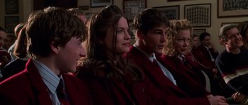 Movie still from “Halloween H20: 20 Years Later” (1998), directed by Steve Miner – A group of young people sitting in a row; Close Up shot, Over the shoulder angle