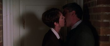 Movie still from “Halloween H20: 20 Years Later” (1998), directed by Steve Miner – A man and a woman kissing each other in the dark; Close Up shot, Low angle
